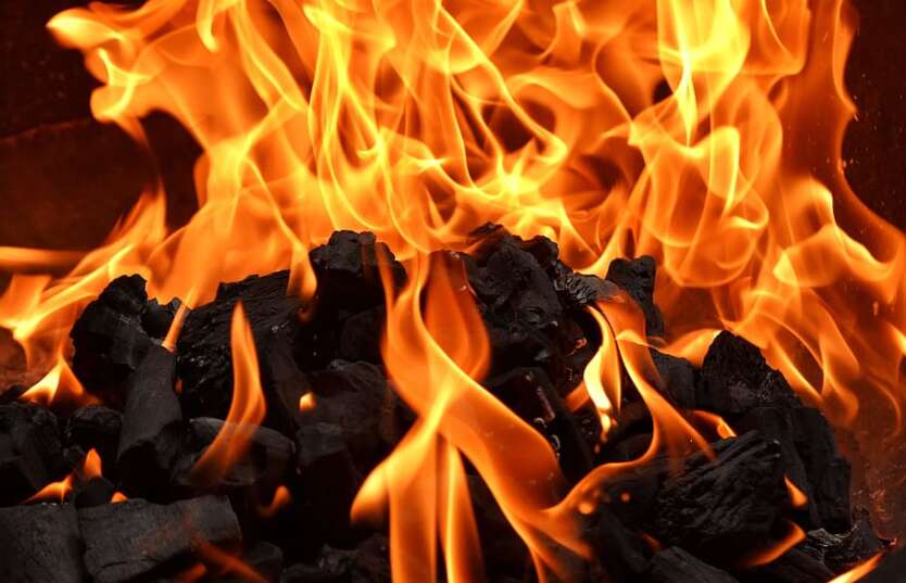 charcoal flame lit by campfire Putty